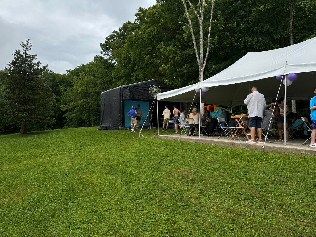 Fore-Play Golf simulator and party tent at a 2026 graduation party in Vernon.